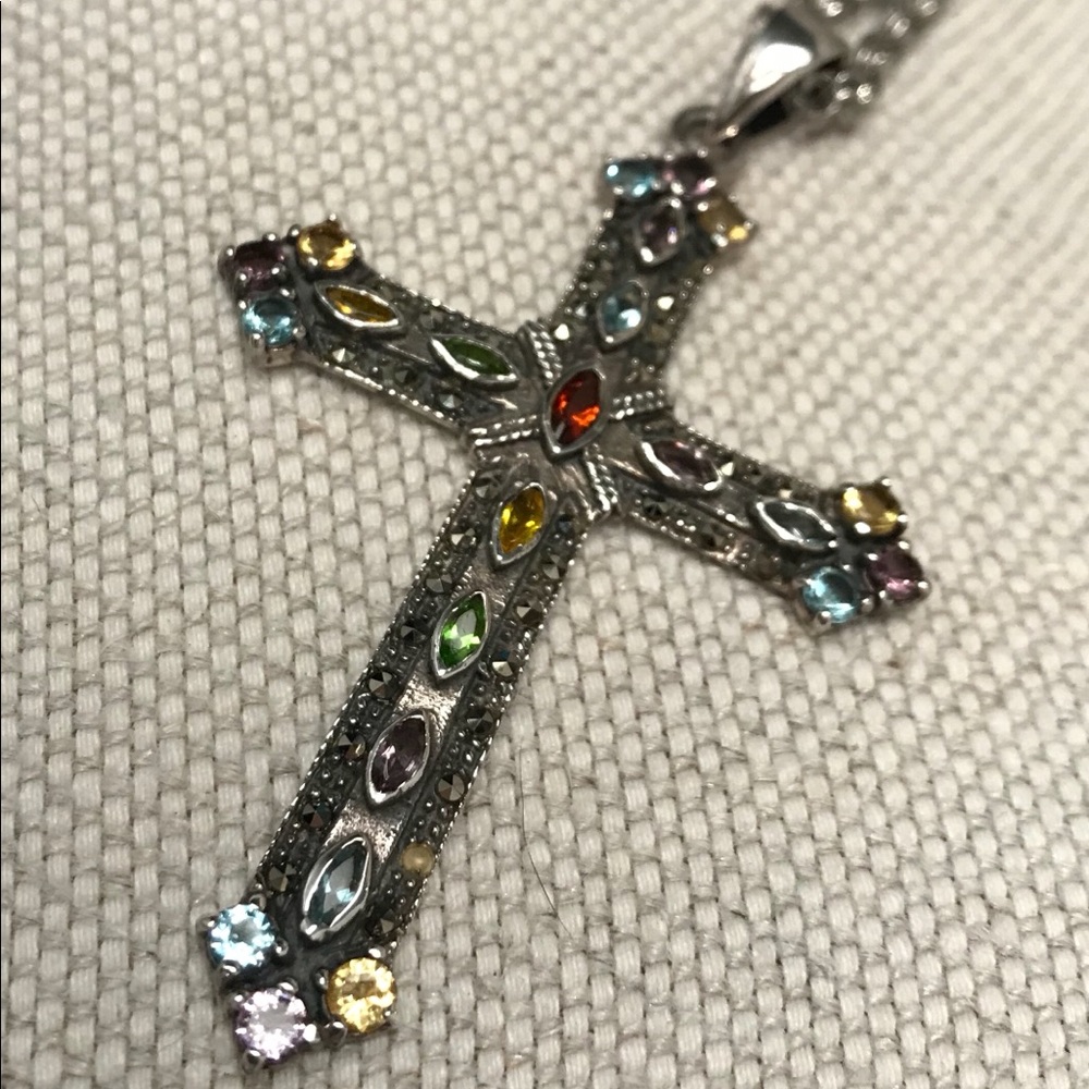 Silver cross with semi-precious stones.
